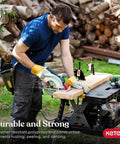 Man using saw on heavy duty folding workbench with 1,000 lb capacity DIY friendly portable shop table for outdoor projects.