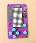 Noob Friendly Soldering Practice Kit For DIY Electronics Projects Learn To Solder With Detailed Circuit Schematics And Hands On STEM Education For Starters, showing purple circuit board with blue buttons and LED display.