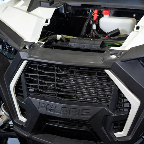 Close-up of open front vehicle compartment showing wiring setup for 4 Channel 100 Amp Solid State Relay Block for Marine, Powersports and Car Accessories.