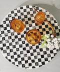 Lazy Susan Organizer With Boho Checkered Mother Of Pearl Inlay 12 Inch Rotating Tray, amber glass decor on checkerboard surface