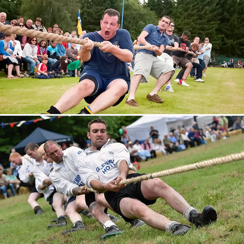 Teams pulling Heavy Duty 4 Strand Manila Rope 1.5 Inch Thick 100 Feet Natural Hemp Rope in a tug-of-war outdoors competition.