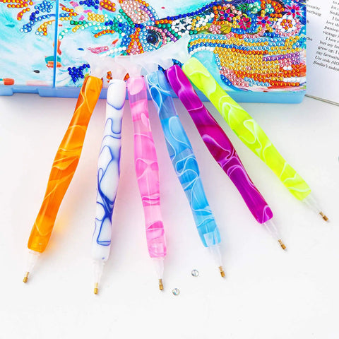 Colorful handmade resin diamond painting pen kit with glue clay and multiple tips for 5D DIY crafts, pink essentials shown on canvas