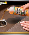 Pouring Disposer And Drain Cleaner With Enzyme Power For Odor Busting Orange Scent 1 Liter into kitchen sink drain.