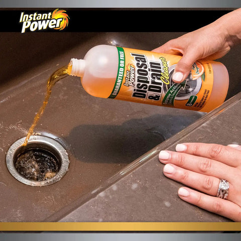 Pouring Disposer And Drain Cleaner With Enzyme Power For Odor Busting Orange Scent 1 Liter into kitchen sink drain.