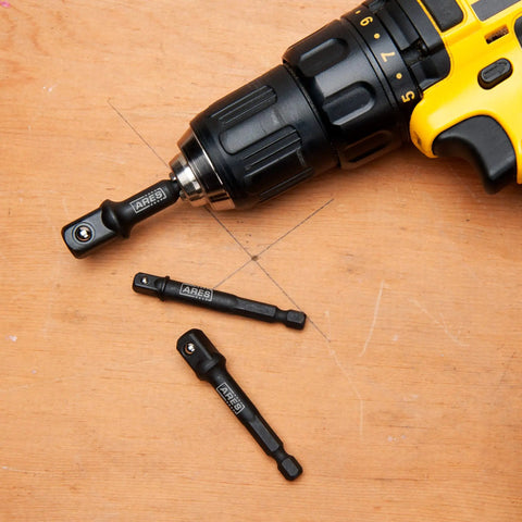 Turn Your Drill Into A High Speed Socket Driver With This Dope Three Piece Impact Grade Socket Adapter Set From ARES Featuring One Quarter Inch, Three Eighth Inch, And One Half Inch Drives And A Three Inch Reach shown with a drill