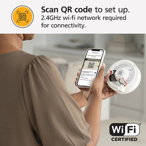 Person scanning QR code for setup of Top Shelf Smart Smoke Detector Delivering Wifi Connectivity Alexa Integration Hardwired Design With Battery Backup Voice And App Alerts Rock Solid Home Defense No Sweat Install Two Pack.