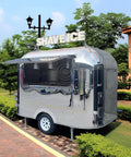 Premium Polished Mirror Food Trailer With Fold Down Awning And Stainless Steel Counter Space For Concession Operators And Mobile Coffee Shops Solid Gear To Crush Sales Daily, featuring an open window and SHAVE ICE sign.