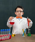 Child in lab coat with Two Pack Plastic Test Tube Rack With Caps Includes Twelve Clear Tubes And Two Red Holder Racks With Six Holes Each