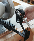 BG-GRIND4 grinding jig system on bench grinder; black steel, adjustable guide for chisels and gouges.