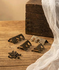 Solid Brass Corner Protectors Bronze Finish 14 Pack Heavy Duty Baseboard Edge Guards on wooden surface with screws.