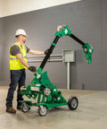 Greenlee 10k Tugger Package Featuring Dual Speed Motor For Faster Pulls, Real-Time Force Indicator Display And Heavy Duty Mobile VersiBoom Tow Rig Gear in use by an electrician