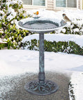 28 Inch Pedestal Bird Bath With Scalloped Bowl Vintage Outdoor Garden Decor Green Resin Weatherproof And Lightweight Backyard Accent That Attracts Birds, Easy Setup, Frost Resistant in snowy garden with birds