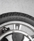 Close-up of Sixteen Inch Bike Tire With Inner Tube Set 16X2.125 for electric bicycles, showing tread pattern and size marking.