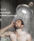 Chrome Fixed Showerhead With 135 Self Cleaning Silicone Nozzles, 1.75 GPM Flow showering water over a man