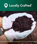 Hands holding Organic Outdoor Potting Mix For Container Plants With Quick Release Natural Fertilizer, OMRI Listed, 16 Qt