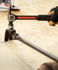 Using 30 Inch Indexing Flat Pry Bar With 180 Degree Head And 15 Lock Positions on wooden floor, dual material grip visible