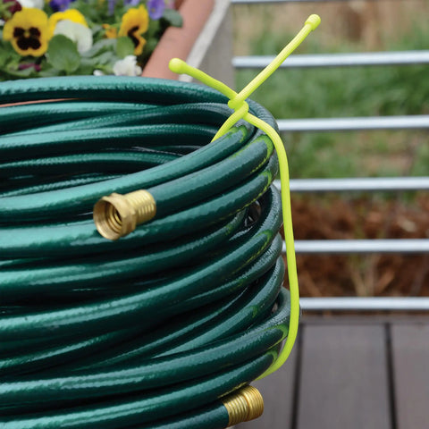 Reusable Rubber Twist Ties Pro Pack Six Pack 18 Inch Assorted Colors securing green garden hose on patio