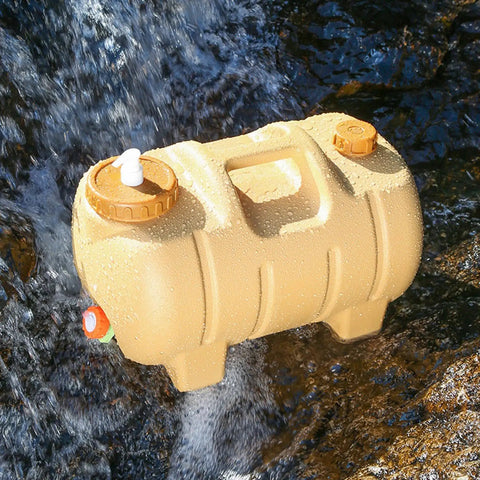 Camping Water Container With Spigot And Soap Dispenser Portable Water Storage Jug on rocky stream