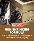 Applying Bondo wood filler for smooth, gap-free finishes on damaged wood surfaces, showcasing non-shrinking formula.