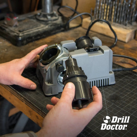 High Speed Portable Drill Bit Sharpener For Standard Twist Bits 3/32 To 3/4 Inch Adjustable Angle workshop tool with hand holding drill bit.