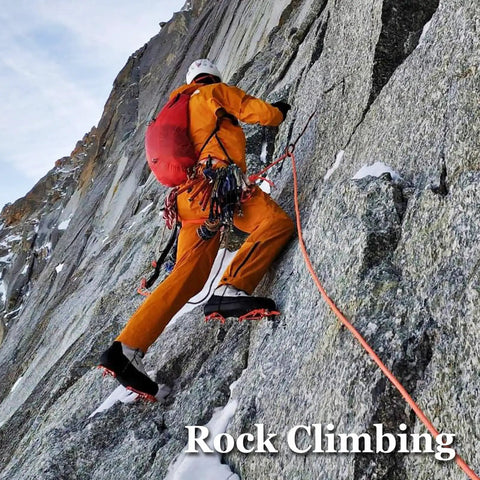 Climber ascending rock face with orange gear and rope, using Half Inch By 100 Ft Double Braid Arborist Rigging Rope For Tree Work Climbing.