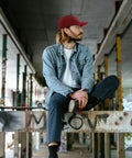 Person wearing Low Profile Unstructured Womens Cap With Breathable Eyelets Six Embroidered Vents And Adjustable Buckle For A Custom Fit In Red