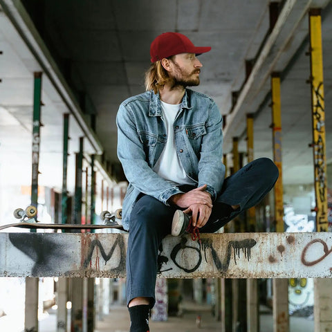 Person wearing Low Profile Unstructured Womens Cap With Breathable Eyelets Six Embroidered Vents And Adjustable Buckle For A Custom Fit In Red