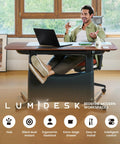 Colamy 55x28 Inch Electric Standing Desk Dual Motor Sit Stand Workstation with walnut finish and ergonomic footrest in a modern office setting.