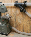 Heavy Duty Four Inch Dust Collection Kit With Y Splitter Hose Connector And Blast Gate Valve For Shop Ready Setup Plus Three Rugged Flex Cuffs For Quick Release No Sweat Operation mounted on a bandsaw.