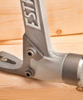 Close-up of AL-PRO Forged Aircraft Aluminum Framing Hammer 14 Oz Straight Rip Claw With Milled Face on wooden surface.