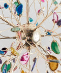 Colorful chandelier with crystal accents and metallic spokes viewed from underneath