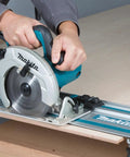 Person using 55 Inch Guide Rail for Plunge Saws and Routers, Delivers Smooth, Dead On Straight or Bevel Cuts on plywood
