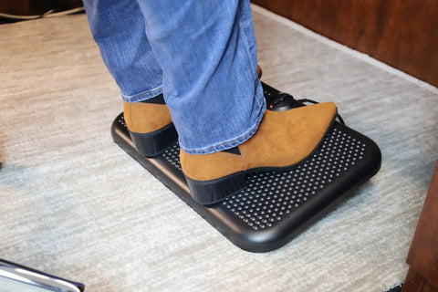 Person using Toasty Toes Foot Warmer And Ergonomic Heated Footrest With Three Adjustable Positions And Two Heat Settings Portable 105 Watt Space Heater In Black