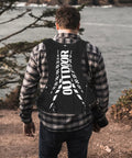 Back view of man wearing Go To Hydration Backpack for Running Cycling and Hiking with Quick Access Water Bladder.