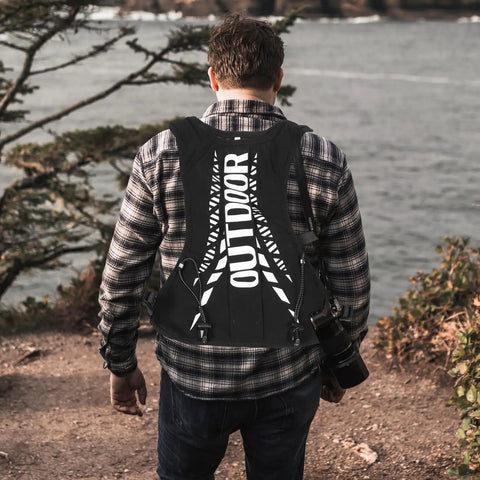 Back view of man wearing Go To Hydration Backpack for Running Cycling and Hiking with Quick Access Water Bladder.