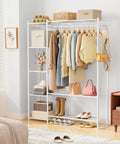 The Go To Portable Wardrobe Closet And Clothes Rack With Four Tier Shelves For Folded Fits And Bags Plus A Double Layer Shoe Rack That Holds Fourteen Pairs and hanging clothes in a bright room.