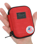 Thrive Mini First Aid Kit in red fabric zippered case; front view with Thrive patch and American-owned sticker.