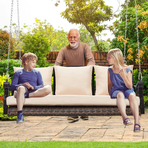 Three Person Wicker Porch Swing With Cup Holder in use, outdoor setting with steel chains and cushions, holds up to 900 lbs