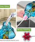 Hand Blown Glass Hummingbird Feeder With Ant Moat And Bee Proof Ports For Outdoor Hanging Leak Proof 360 Degree Perch 22 Ounce Blue Gift For Women Men Mom Dad, showing easy filling, cleaning, and bee-proof flower port.