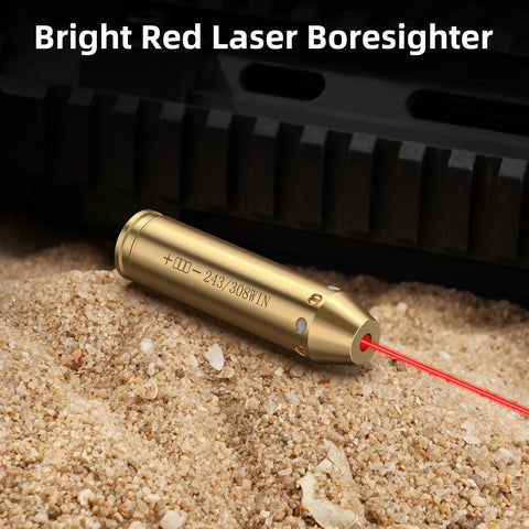 Bore Sight Laser For 243 And 308 Caliber Rifles, Red Dot Sighting Tool in brass, emitting red laser on sand surface