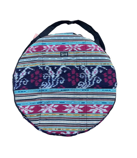 Slick Cotton Ikat Carry Case For Twenty Four Inch Shaman Drum In Bold Red Built Different With A Comfy Adjustable Strap top view with colorful woven design.