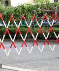Built Tough And Ready To Roll Expanding Durable FRP Retractable Traffic Barrier, red and white folding guardrail for site protection.