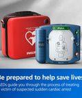 Front view of Philips HeartStart OnSite AED defibrillator (blue) with red standard carry case.