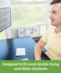 Dual Blade Digital Window Fan With Programmable Thermostat For Home Cooling in window, showing expandable side panels
