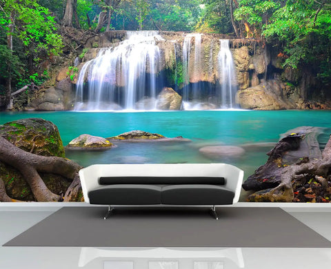 Epic Deep Forest Waterfall Wall Mural Peel And Stick Self Adhesive Wallpaper Large 141.7 By 98.4 Inches Six Panel Set For Living Room And Dining Room Decor Nature Landscape Poster featuring a serene waterfall over rocks in a lush forest, viewed from a modern living room with a black and white sofa.