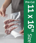 Person holding 100 Count Gallon Vacuum Sealer Bags 11 X 16 Inches Precut Heavy Duty BPA Free for quick storage of meat.