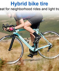Cyclist on a road using a bike equipped with 2 Pack 700x32c Road Bike Tires And Tubes 32-622 700C Foldable Tires