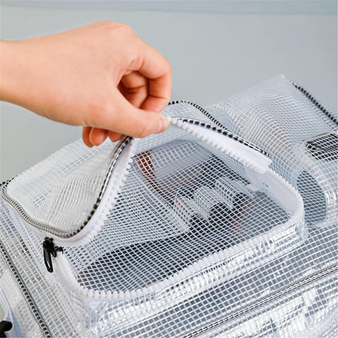 Hand opening the zipper of a Clear Pvc Crossbody Shoulder Bag For Tool Storage And Work Equipment Cleanroom Organizer Purse.