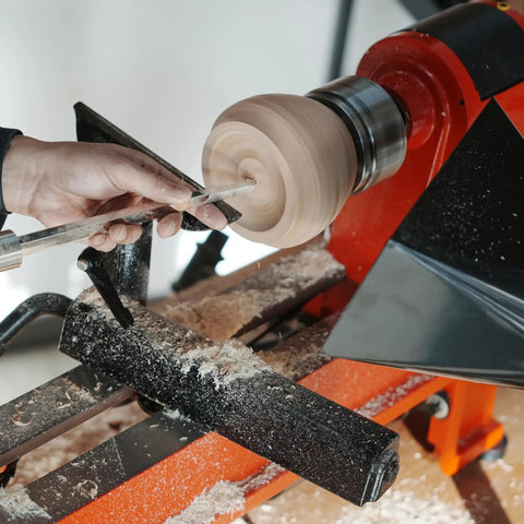 Heavy Duty Woodturning Hollowing Tool With Replaceable Carbide Tipped Round Blade And Solid Beech Handle in use on a lathe.