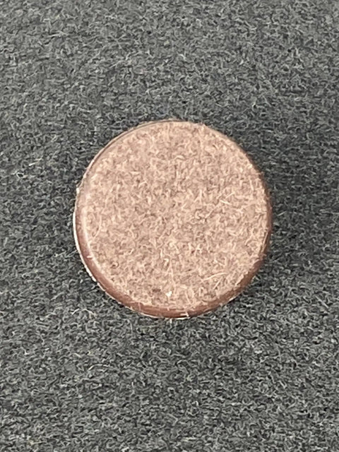 Heavy Duty Nail On Furniture Glides Brown 100 Pack Smooth Chair Pads for Hardwood Tile And Laminate Floors close-up image showing one glide.